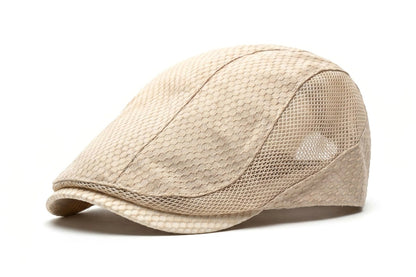 Beige cap with mesh design on a white background