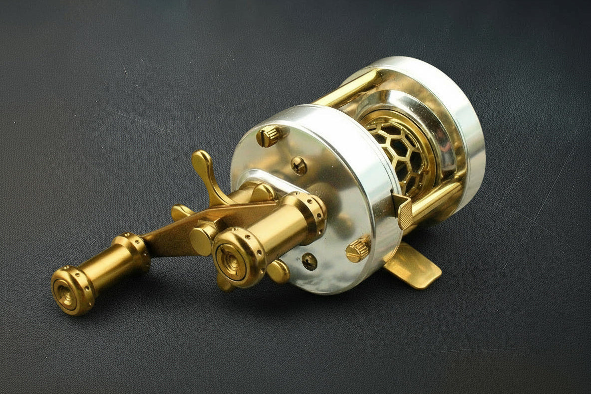 Brass fishing reel on a dark background